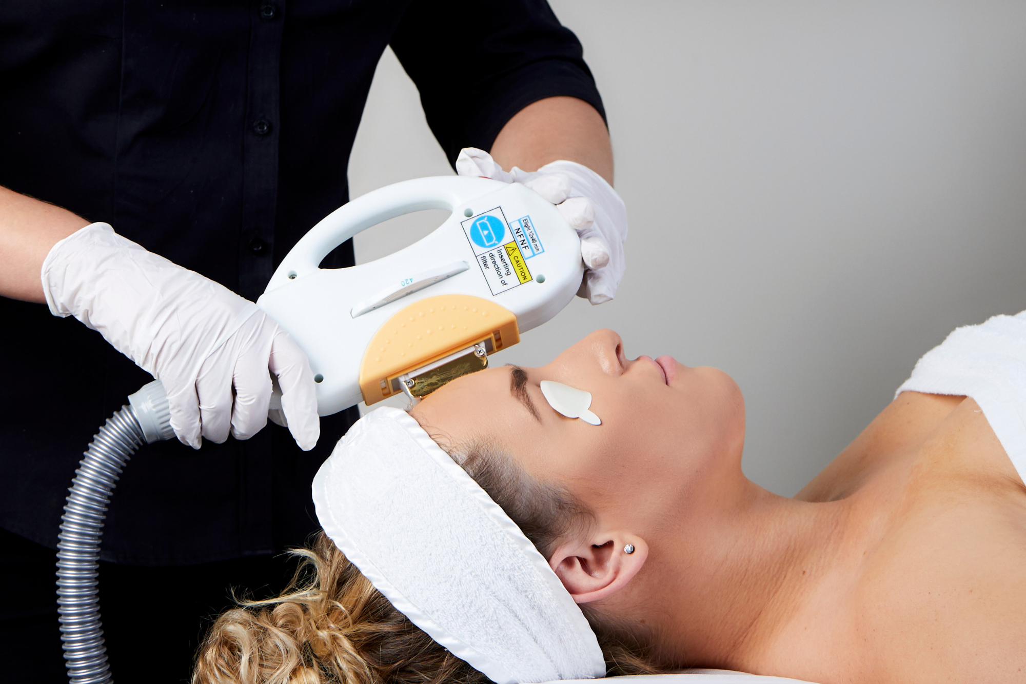 IPL device treatment for skin rejuvenation being performed